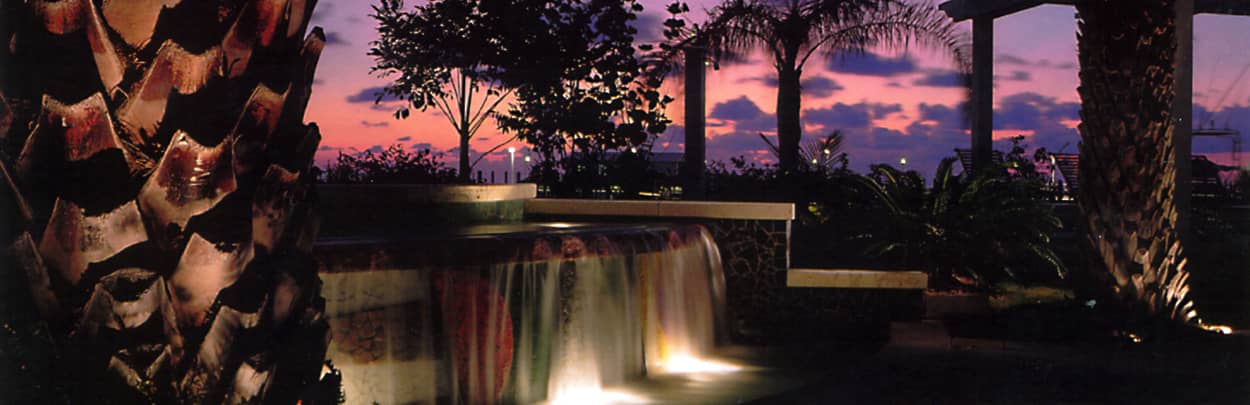 A resort waterfall at sunset