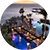 A sunset view of an infinity pool, pergola, and ocean