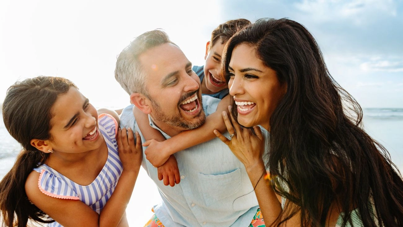 A family at enjoying the beach at Hyatt Vacation Club at The Welk.  