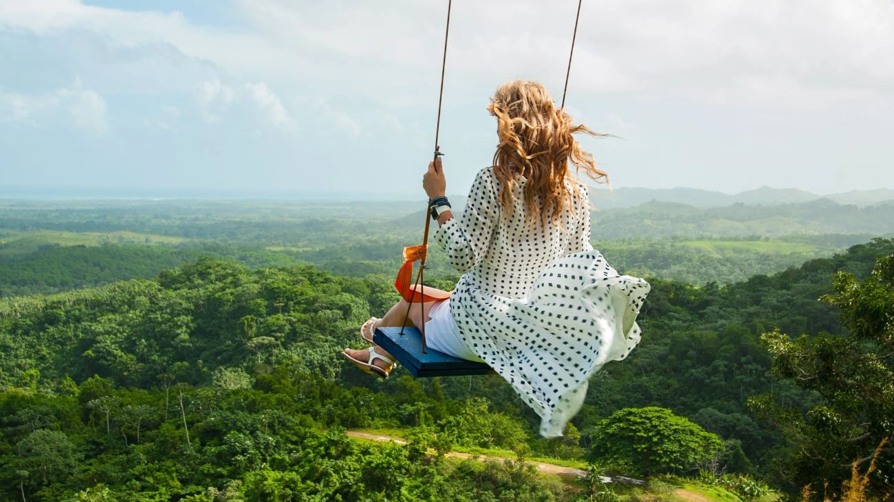 A woman on a scenic swing in Montaña Redonda. 