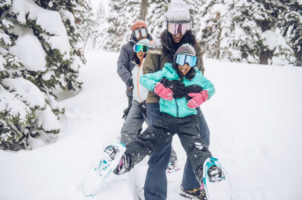 Family playing in the snow at the ski resort Northstar California.