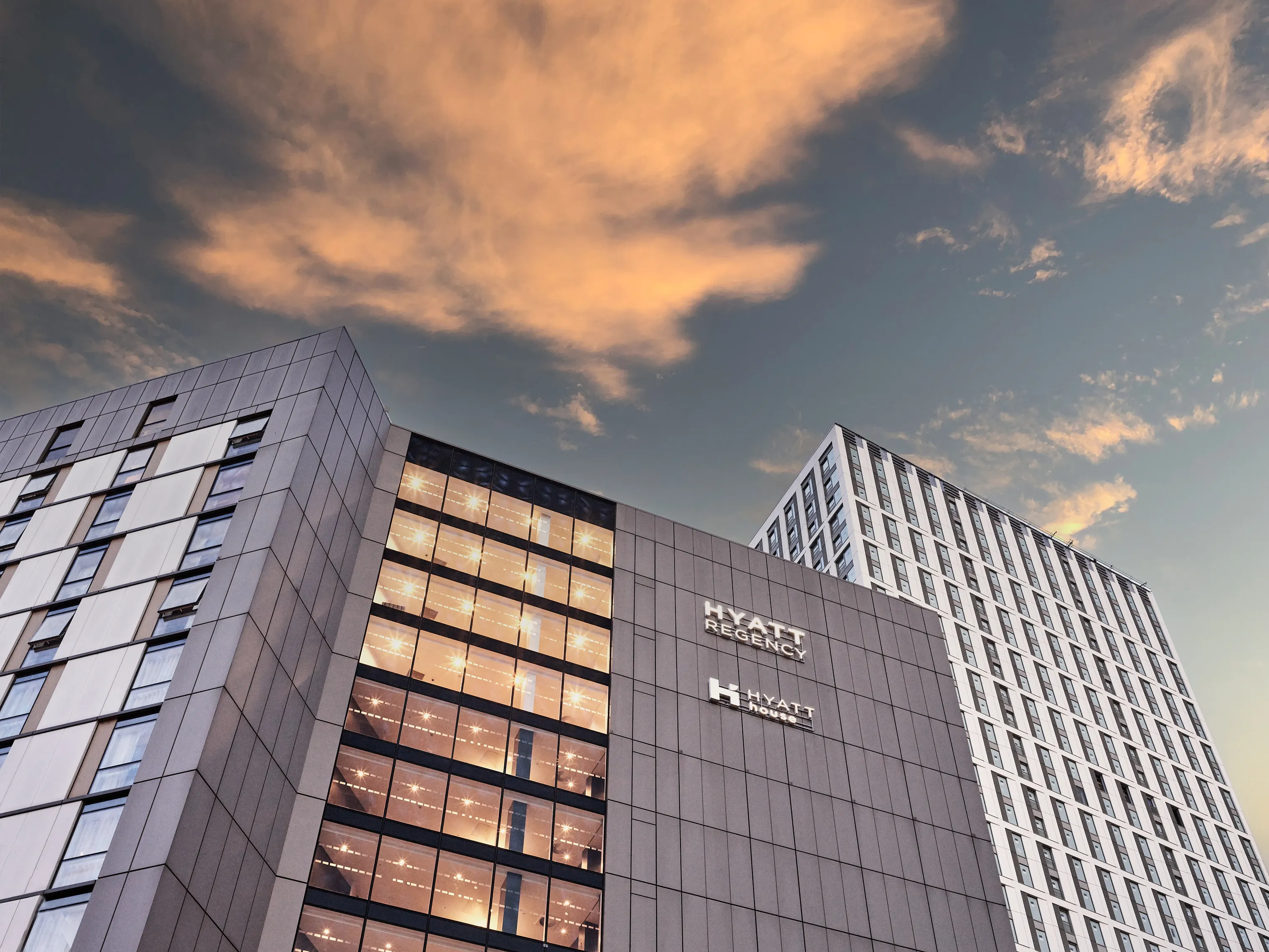 Hotel signage mounted on building facade.