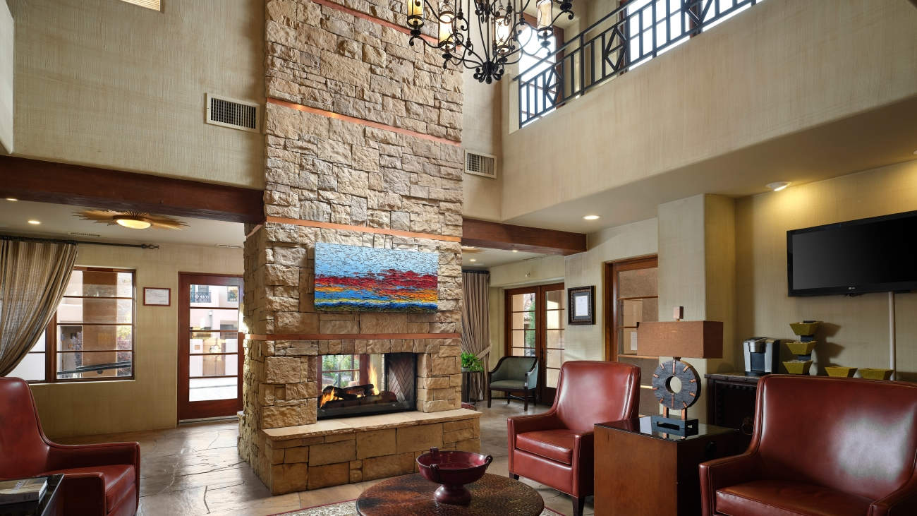 A stone-lined fireplace sits in the center of the resorts lobby