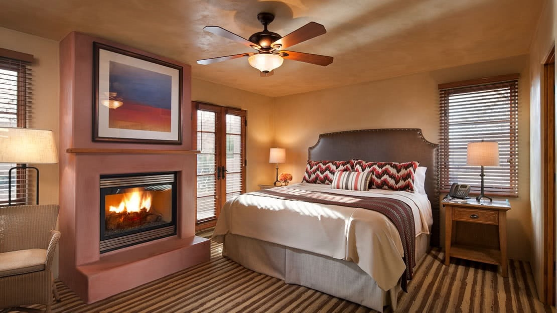 Southwestern bedroom with fireplace