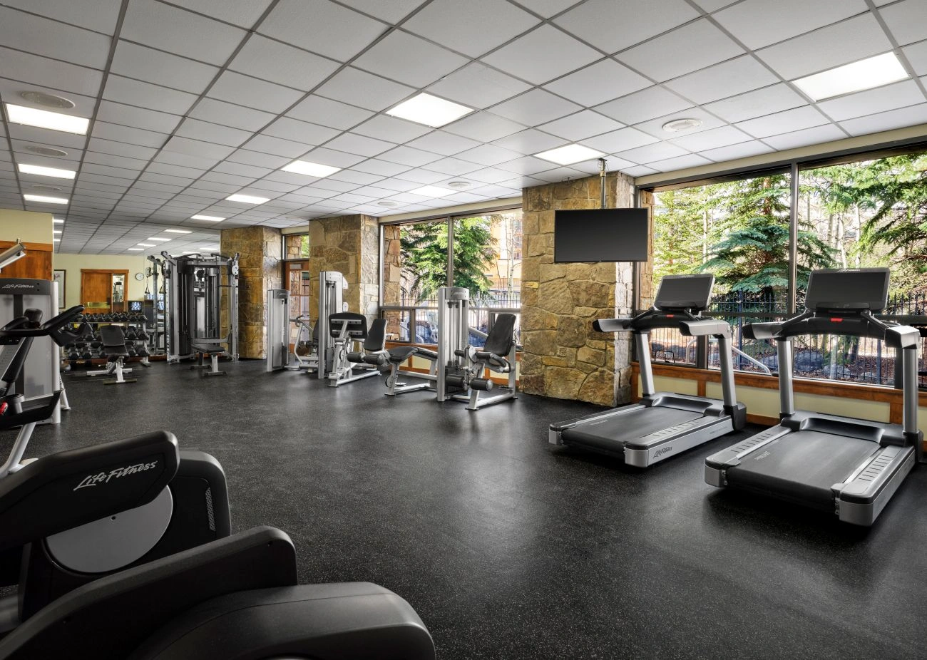 Fitness machines and weights sit in a fitness center
