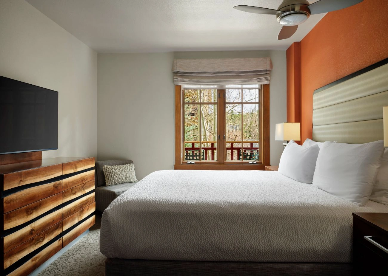 View of villa bedroom with rustic wood accents