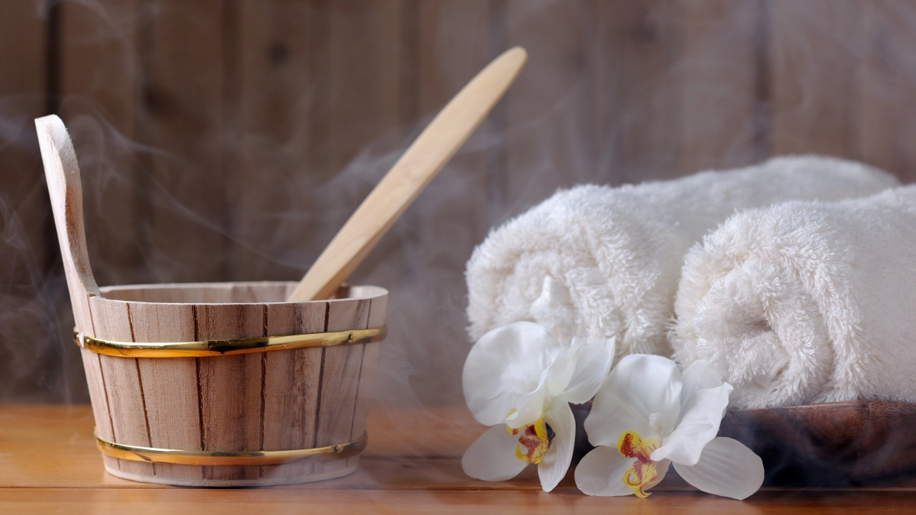 Water bucket and steam towels at a sauna