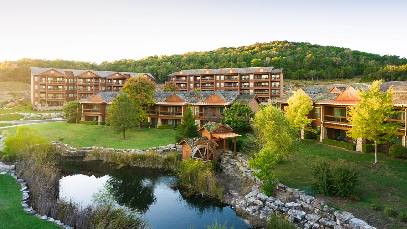 Green trees surround The Lodges at Timber Ridge