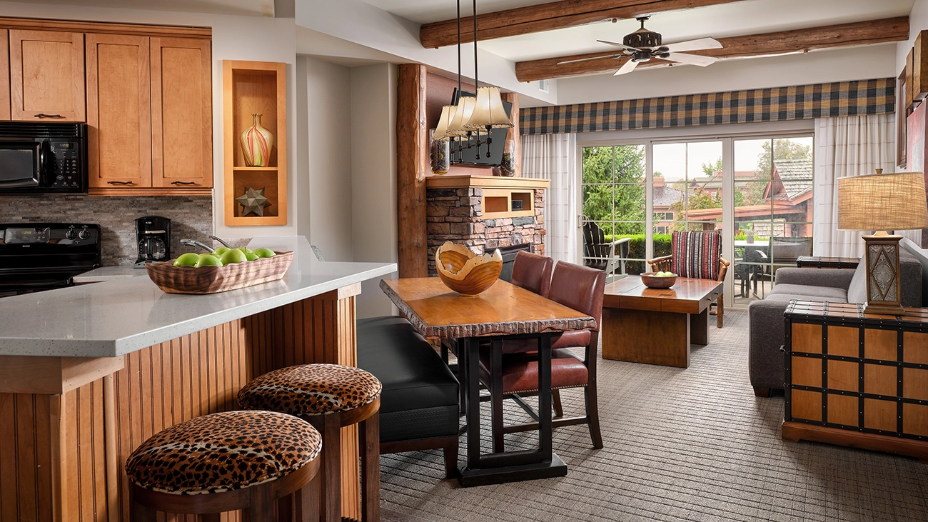 Couches, a dining area, and chairs make up the large sitting area of the villa