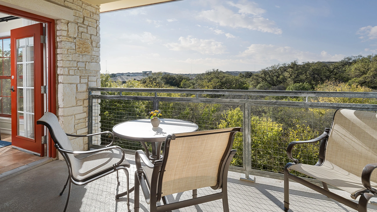 A couple taking a selfie in front of a historic building in San Antonio area
