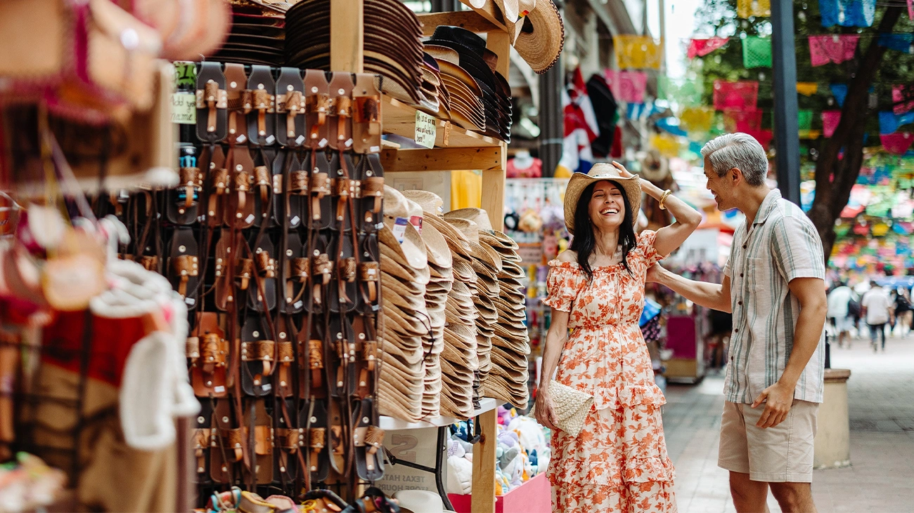 A couple shopping for cowboy hats in San Antonio area